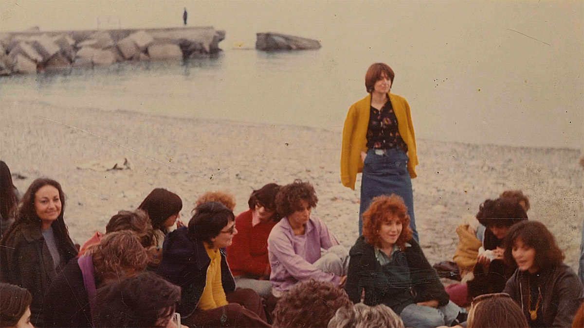 Alex Martinis Roe, It was an unusual way of doing politics; there were friendships, loves, gossip, tears, flowers…, film still of a photograph of a meeting  of groups from Milan, Turin, and Paris at Varigotti, Liguria in 1973, courtesy of the Milan Women’s Bookstore co-operative, 2014.