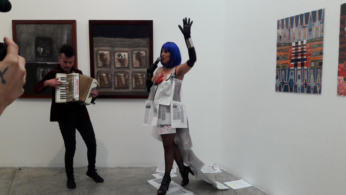 Fig. 8. Julia Antivilo performs with documents from Mayer’s archive during a tour of the exhibition, 30 June 2016. Photo courtesy  of Karen Cordero Reiman. 